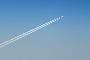 plane leaving cloud contrails
